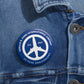 Peace of Mind Logo Blue Pin Button